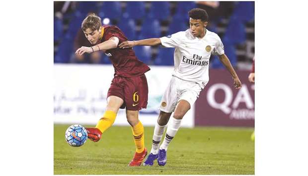 Roma (in maroon) and PSG (in white) players vie for the ball during the under-17 Alkass International Cup at the Aspire Academy yesterday. PICTURES: Jayaram
