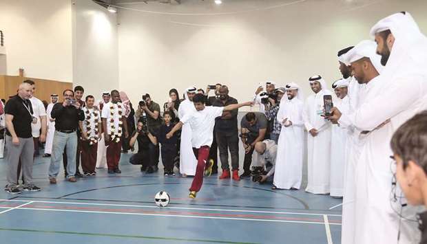 SHOOT-OUT: Students of the centre participated in a friendly shoot-out against 2019 AFC Asian Cup champions, with some students managing to score goals. Photos by Anas al-Samaraee