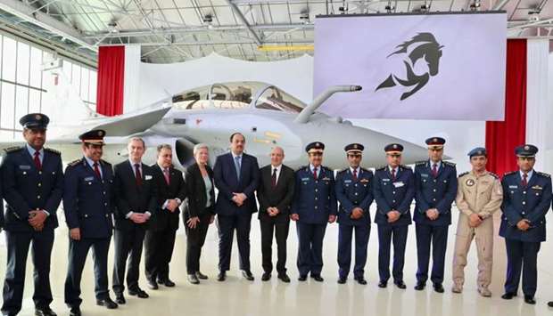 Deputy Prime Minister and Minister of State for Defence Affairs HE Dr Khalid bin Mohamed al-Attiyah is seen with Qatari and French officials after a ceremony during which the first Rafale fighter jet was delivered to Qatar.