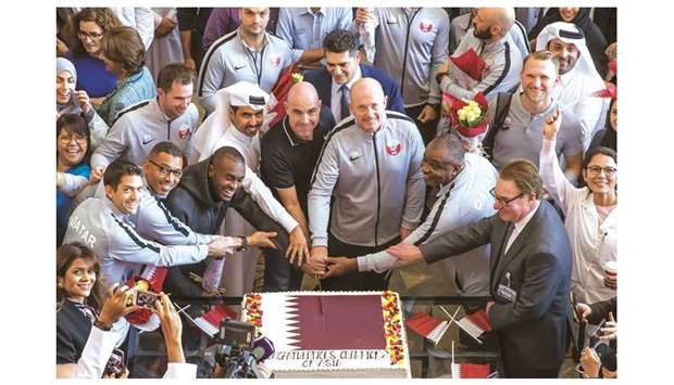Aspetaru2019s acting chief executive officer Dr Abdulaziz al-Kuwari, Qatar national football team head coach Felix Sanchez, defender Abdelkarim Hassan and other officials cut a cake in celebration of Qataru2019s AFC Asian Cup win.