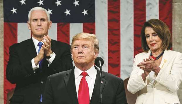 President Donald Trump delivers the State of the Union address as Vice President Mike Pence and Speaker of the House Nancy Pelosi look on at the US Capitol in Washington, DC.