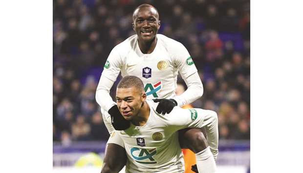 Paris St Germainu2019s Moussa Diaby (top) celebrates with Kylian Mbappe  after scoring against Villefranche in the French Cup last 16 match in Lyon, France on Wednesday night. (Reuters)