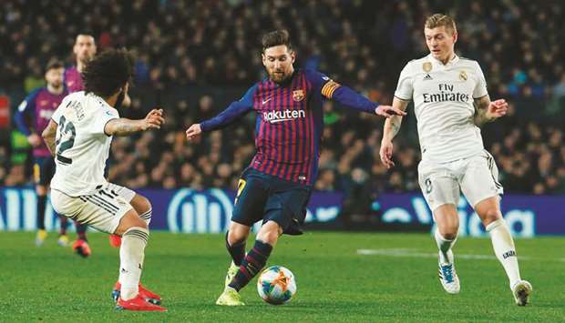 Barcelona superstar Lionel Messi (centre) vies for the ball with Real Madridu2019s Marcelo (left) and Toni Kroos during the Copa del Rey semi-final first leg match at the Camp Nou stadium in Barcelona on Wednesday night. (AFP)