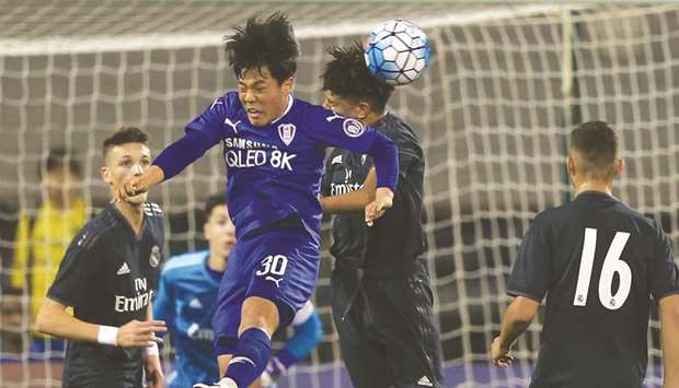 Action from the match between Suwon Samsung (in blue) and Real Madrid (in black) in the Alkass International Cup yesterday.