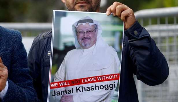 A demonstrator holds picture of Saudi journalist Jamal Khashoggi during a protest in front of Saudi Arabia's consulate in Istanbul, Turkey, October 5, 2018