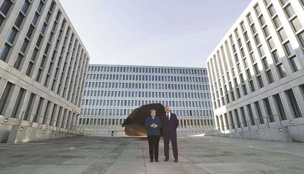 Merkel and BND chief Bruno Kahl pose during the official opening of the BND building in Berlin.