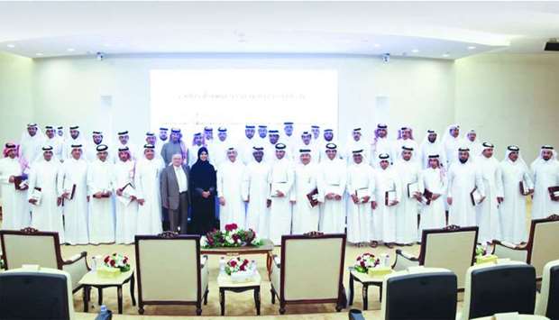 HE the Minister of Administrative Development, Labour, and Social Affairs Yousef bin Mohamed al-Othman Fakhroo with other dignitaries and course participants at the graduation event.