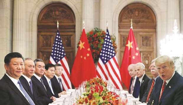 US President Donald Trump, US Secretary of State Mike Pompeo, Trumpu2019s national security adviser John Bolton and Chinese President Xi Jinping attend a working dinner after the G20 leaders summit in Buenos Aires (file). US negotiators are preparing to press China next week on longstanding demands that it reform how it treats American companiesu2019 intellectual property in order to seal a trade deal that could prevent tariffs from rising on Chinese imports.