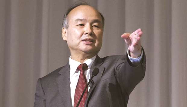Masayoshi Son, chairman and chief executive officer of SoftBank Group, gestures as he speaks during a news conference in Tokyo. Sonu2019s grand vision for SoftBank Group Corp has been dealt a setback by an internal power struggle between two of his closest lieutenants.