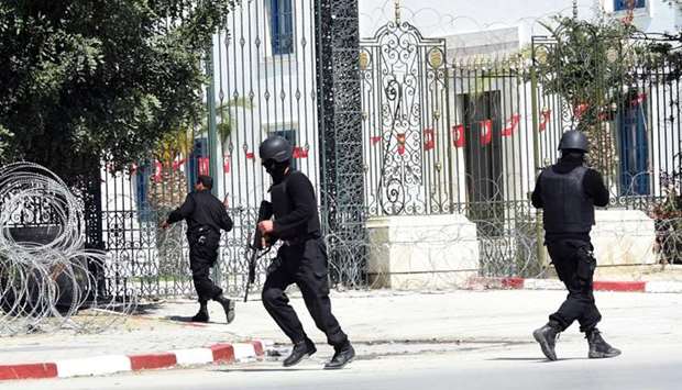 In this file photo taken on March 18, 2015, Tunisian security forces secure the area after gunmen attacked Tunis' famed Bardo Museum on March 18, 2015