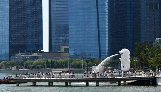 People gather on a jetty at Merlion Park in Singapore on February 5.