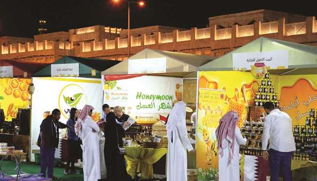 Visitors explore various brands of honey on display during the festival. PICTURES: Thajudheen