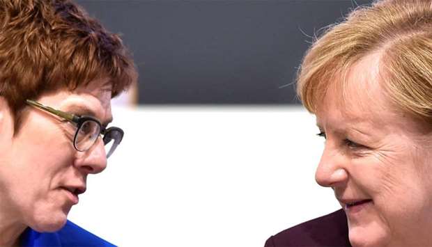 German Chancellor Angela Merkel (right) talks to Annegret Kramp-Karrenbauer