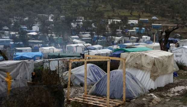 A view of temporary camp for refugees and migrants next to the Moria camp during heavy rainfall on the island of Lesbos, Greece