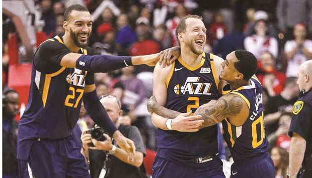 Utah Jazz guard Joe Ingles (centre) celebrates with teammates Rudy Gobert (left) and Jordan Clarkson after their win over Houston Rockets. (USA TODAY Sports)