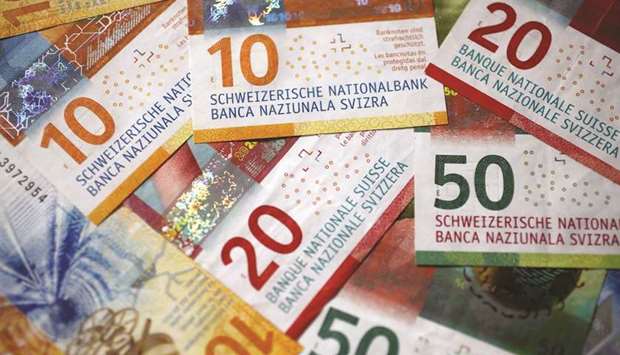 Swiss franc banknotes are seen in an arranged photograph in Bern, Switzerland. Souring market sentiment from the coronavirus and geopolitical tensions have driven the haven currency up 1.5% this year.