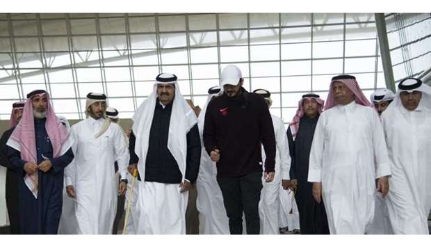 His Highness the Father Amir Sheikh Hamad bin Khalifa Al-Thani  carries out a walking exercise