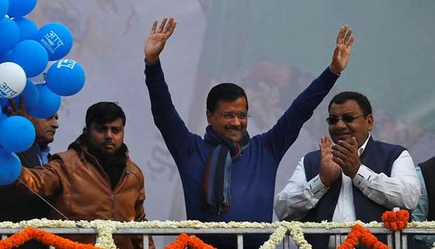 Delhi Chief Minister and leader of Aam Aadmi Party (AAP) Arvind Kejriwal waves to his supporters during celebrations at the party headquarters in New Delhi, India