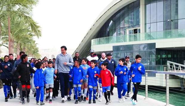 His Highness the Amir Sheikh Tamim bin Hamad al-Thani taking part in the activities of the Qatar National Sport Day in Lusail Promenade