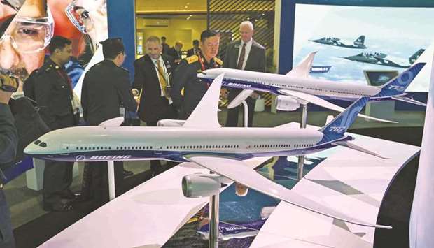 Boeing 777 and 787 airplane models are exhibited at the Singapore Airshow yesterday.