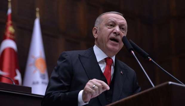 Turkish President Tayyip Erdogan addresses members of his ruling AK Party at the parliament in Ankara