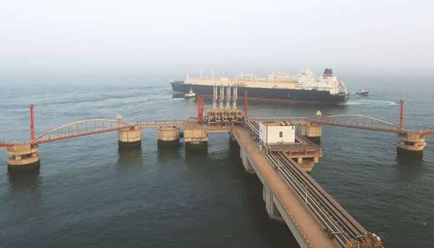 A liquefied natural gas tanker leaves the dock after discharge at PetroChinau2019s receiving terminal in Dalian, Liaoning province. Chinau2019s LNG demand is only expected to grow by 4% year-on-year, compared with previous estimates of 13%, analysts said yesterday.