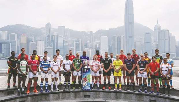 In this file photo taken on April 5, 2017, captains of teams competing in the annual Hong Kong Rugby Sevens pose with the winneru2019s trophy during a promotional event in Hong Kong. (AFP)
