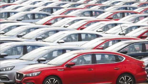 Cars for export wait to be loaded onto cargo vessels at a port in Lianyungang, Jiangsu province. Retail car sales fell 22% to 1.71mn units, the biggest-ever drop for the month of January, the China Passenger Car Association said yesterday.