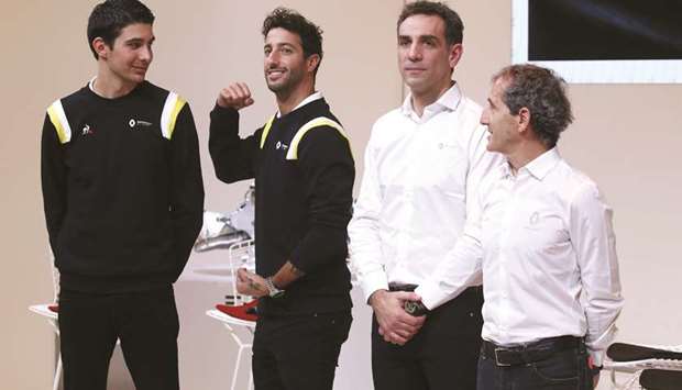 Renault F1 drivers Esteban Ocon (left) and Daniel Ricciardo (second from left) with team managing director Cyril Abiteboul and former F1 champion Alain Prost (right) at a news conference in Paris, France, on Wednesday. (Reuters)