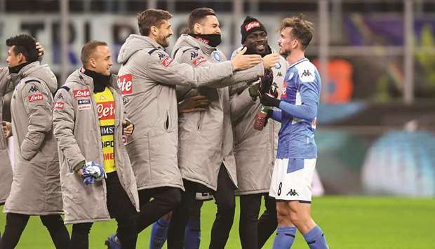 Napoliu2019s Fabian Ruiz (right) celebrates with teammates after winning the Italian Cup semi-final against Inter Milan. (Reuters)