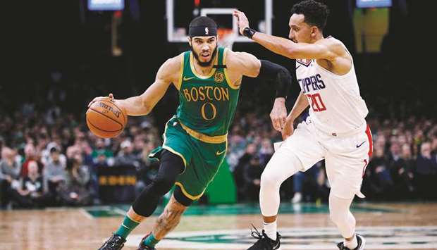 Boston Celtics forward Jayson Tatum (left) drives against Los Angeles Clippers point guard Landry Shamet during the second half at TD Garden. PICTURE: USA TODAY Sports