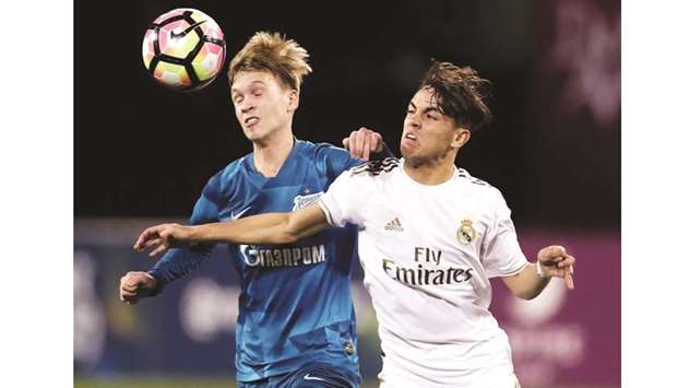 Action from the Zenit vs Real Madrid match in the Al Kass Cup tournament yesterday. At bottom, Real Madrid players celebrate their win.