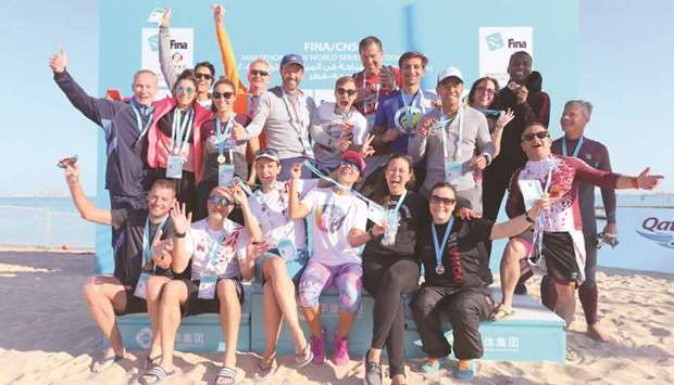 Winners pose after the Doha Open Water Challenge at Katara Beach yesterday.