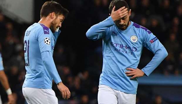 In this file photo taken on October 01, 2019 Manchester City's Spanish midfielder David Silva (L) and Manchester City's Portuguese midfielder Bernardo Silva (R) react to a missed chance during the UEFA Champions League Group C football match between Manchester City and Dinamo Zagreb at the Etihad Stadium in Manchester, north west England. AFP