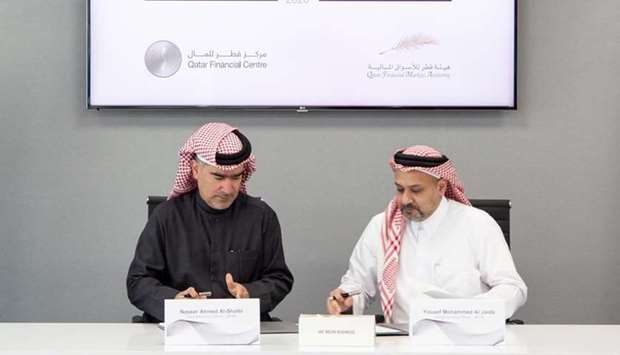 Nasser Ahmed Al-Shaibi, CEO of the QFMA, and Yousuf Mohamed Al Jaida, CEO and Board Member of QFCA sign the MoU
