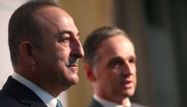 German Foreign Minister Heiko Maas and Turkish Foreign Minister Mevlut Cavusoglu talk to the media after a meeting during the Munich Security Conference in Germany