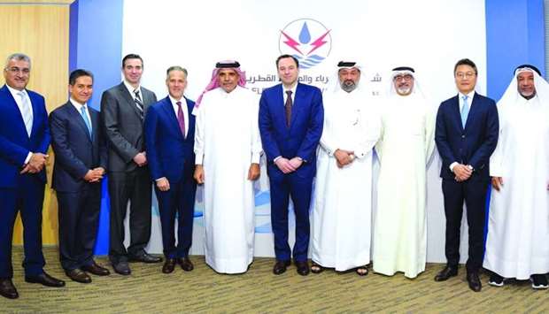 Director & General Manager of QEWC Fahad Hamad al-Mohannadi, Scott Strazik, CEO of GE Gas Power, Joseph Anis, President & CEO of GE Gas Power Middle East, North Africa & South Asia and other senior leaders from both organisations.
