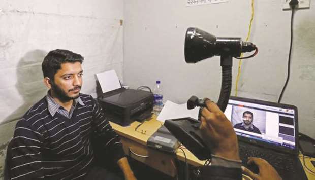A man goes through the process of eye scanning for the Unique Identification (UID) database system, also known as Aadhaar, at a registration centre in New Delhi, India, in this January 17, 2018, photograph.