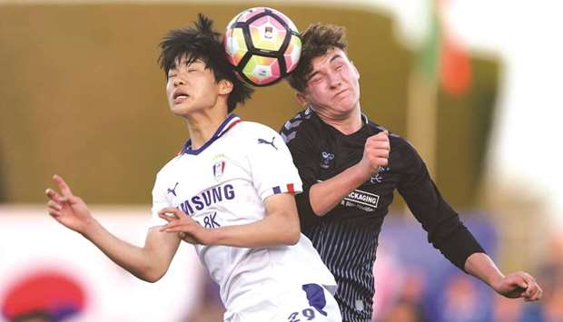 Glasgow Rangers (right) and Suwon Samsung players go for a headers during the Al Kass International Cup. PICTURE: Jayaram