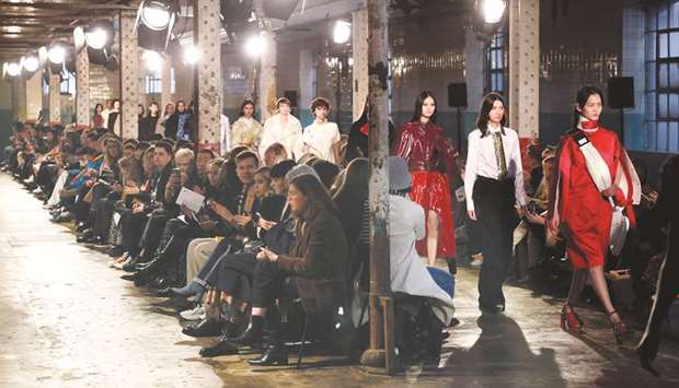 Models present creations by designer Richard Malone during a presentation on Friday for their Autumn/Winter 2020 collection, on the first day of London Fashion Week.