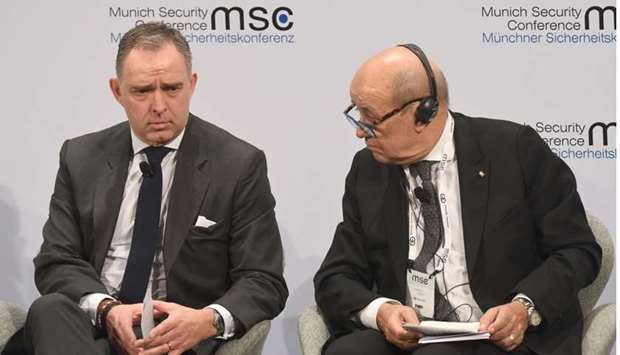 British National Security Adviser to the Prime Minister Mark Sedwill (L) and French Foreign Minister Jean-Yves Le Drian attend the 56th Munich Security Conference (MSC) in Munich, southern Germany