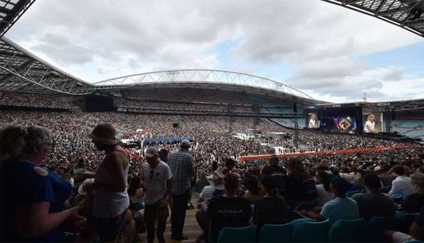 Fans watch US rocker Alice Cooper and his band performing at the Fire Fight Australia, a concert for National Bushfire Relief in Sydney