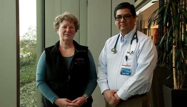 SPOTLIGHT: Dr George Diaz, Division Chief of Infectious Diseases, right, and Robin Addison, registered nurse, at Providence Regional Medical Center in Everett, Washington, on February 11.
