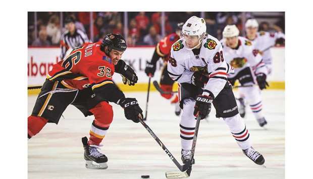 Chicago Blackhawksu2019 Patrick Kane (right) and Calgary Flamesu2019 Zac Rinaldo (left) battle for the puck during the first period at Scotiabank Saddledome. PICTURE: USA TODAY SportsBlackhawks rack up 8 goals to sink Flames