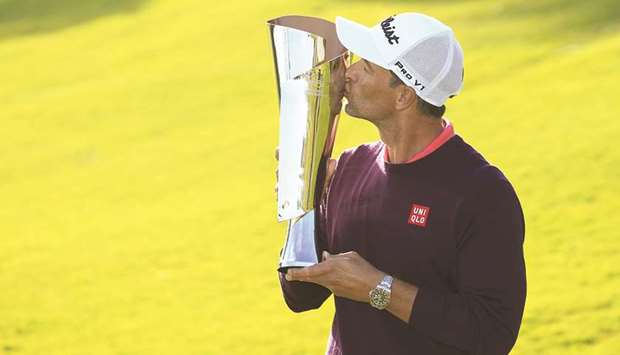 Adam Scott of Australia poses with the trophy after winning the Genesis Invitational in Pacific Palisades, California, on Sunday. (AFP)