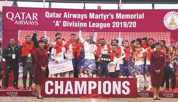 San Miguel Machhindra Club players celebrate after winning the Qatar Airways u2018Au2019 Division Martyru2019s Memorial League in Kathmandu, Nepal, on Saturday.