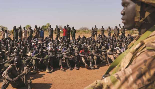 South Sudan Peopleu2019s Defence Forces (SSPDF), South Sudan Opposition Alliance (SSOA), and The Sudan Peopleu2019s Liberation Movement in Opposition (SPLM-IO) soldiers gather at the training site for the joint force to protect VIPs in Gorom outside Juba, South Sudan, yesterday.