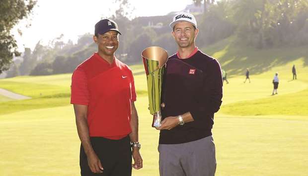 Adam Scott (right) of Australia poses with tournament host Tiger Woods and the trophy after winning the Genesis Invitational in Pacific Palisades, California. (AFP)