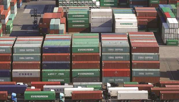 Shipping containers are seen at a port in Tokyo. Japanu2019s gross domestic product in the three months to December shrank 1.6% from the previous quarter, even before the novel coronavirus outbreak in China hit Japan, according to official data published recently.