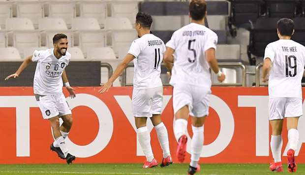 Al Saddu2019s Hassan al-Haydos (left) celebrates his goal with teammates during the AFC Champions League match against Sepahan at Jassim Bin Hamad Stadium in Doha yesterday. PICTURES: Noushad Thekkayil